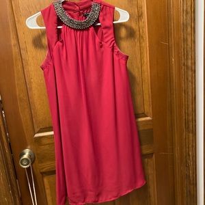 Red flowy dress with sequined trim collar